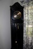 Tall Case clock c.1920 German Ebonized Oak with Seth Thomas works (needs servicing, but works) with cornucopia bonnet top, convex glass clock door and divided glass lite lower door for pendulum sitting on curved feet.