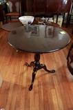 c. 1780 Southern Mahogany Queen Anne tilt top tea table, poss. Charleston, resting on turned ring baluster and snake foot tripod legs. Restored. Repair to one leg with period foot replacement. Age crack stabilized in single board top. Refinished.
