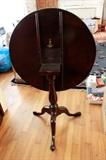 c. 1780 Southern Mahogany Queen Anne tilt top tea table, poss. Charleston, resting on turned ring baluster and snake foot tripod legs. Restored. Repair to one leg with period foot replacement. Age crack stabilized in single board top. Refinished.