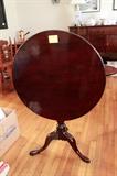 c. 1780 Southern Mahogany Queen Anne tilt top tea table, poss. Charleston, resting on turned ring baluster and snake foot tripod legs. Restored. Repair to one leg with period foot replacement. Age crack stabilized in single board top. Refinished.
