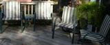Green striped outdoor chairs.