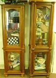 Two similar display/curio cabinets.