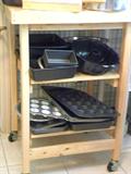 Folding butcher block cart, cake pans, loaf pans, bake ware, muffin tins.