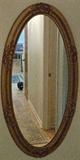 Vintage large oval gilt gesso mirror.