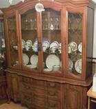 China closet from pecan dining room set, Mikasa Alton platinum trimmed china service, platinum trimmed stemware.