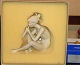 Lovely classic white bisque porcelain figurine of a nude girl playing the pipes, by Kaiser (KPM), of Germany. Shown photographed in its original box to keep its surface pristine.