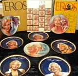 Selection from Marilyn Monroe collectibles. Several sets of plates depicting Marilyn in all her fabulous blonde bombshellness, including a Van Hygan and Smythe wood-framed set, ready to hang, not shown here. The frames alone cost $20. And in the background, the four volume set of Eros, a hard-covered art magazine from 1962, one of which features Marilyn's final photo shoot.