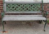 Garden bench, wood and verdegris finish metal, floral trellis motif.