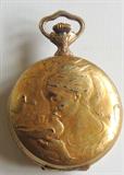 Swiss gold-plated jeweled movement pocket watch. Doe and fawn on one side, woman holding dove on the reverse.