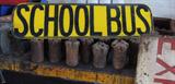 One of a pair of vintage school bus signs.