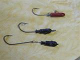 Several vintage fishhooks.