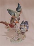 Colorful Rosenthal porcelain bird grouping. This animated trio of birds is perched on a branch eating berries. Pre-WWll Germany.