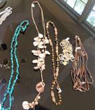 Selection from jewelry, rhinestone, freshwater pearl, Anne Klein, Mexican sterling, Italian sterling, enameled, chains, everyday watches, artisan rhinestone studded cuff and earrings on white leather, mother of pearl, tiger-eye, turquoise chip necklace, more.