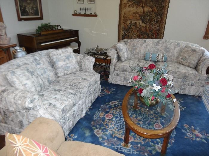 Though the fabric matches, one is a little longer than the other (couch and loveseat)