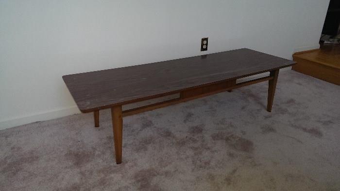 Mid-century coffee table, now covered with "stuff" for the sale.