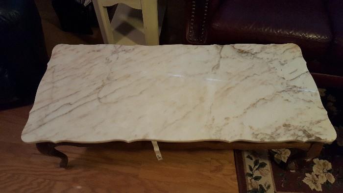 a better view of the marble top of the coffee table