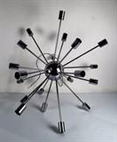 Item Description: A lovely retro style chrome tone metal light fixture which resembles an artistic sunbeam featuring a center ball with 20 straight metal light arms with cylindrical bulb housing. Hard wired construction.