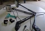 Item Description: A pair of Halogen Swing Arm clamp mount black desk lamps.