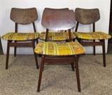 Item Description: Four Mid Century Danish Modern Jens Risom Design dining chairs comprised of walnut and reupholstered retro fabric to seat.