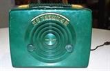 Item Description: A wonderful 1950's Crosley portable superheterodydne tube radio receiver model 10-306 with a Art Deco style housed in hard green plastic adorn with handle to top and gold embossed station numbers to face.