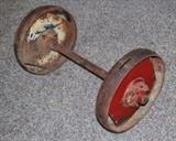 Item Description: A great crusty Industrial salvage wheel featuring a center axel flanked by heavy metal wheels.