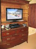 Inside antique linen press: Note: TV is not for sale