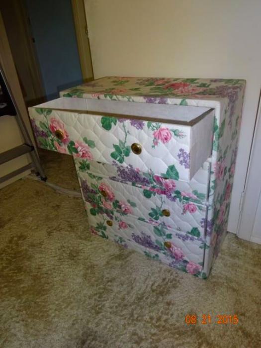 A floral upholstered dresser