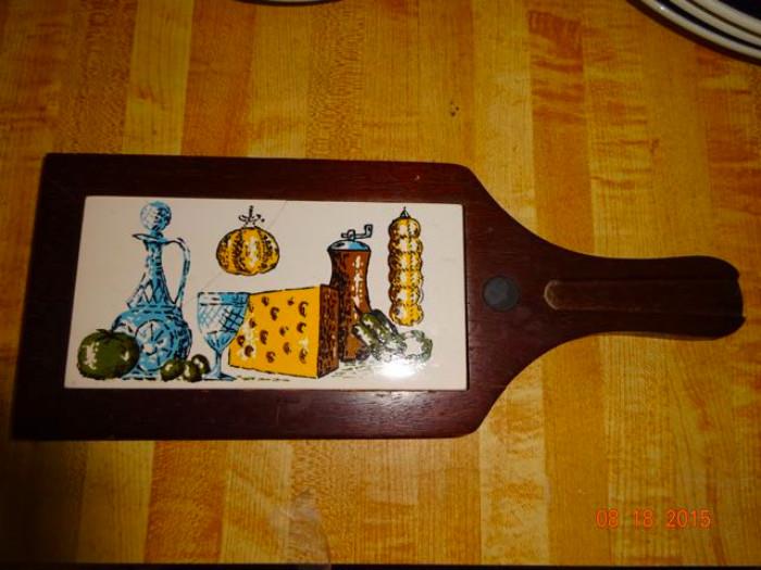 A wine and cheese cutting board