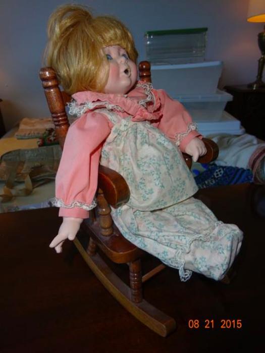A porcelain doll on a rocker