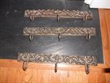Three nice burnished iron decorative hooks