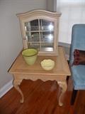 Blonde side table with small mirrored display cabinet sitting on top