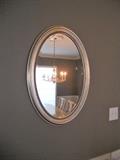 One of 2 oval mirrors with silver finish