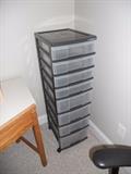 One of several plastic stacking storage bins