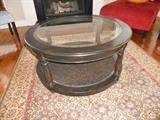 Round table with glass top and caned lower level--purchased from Storehouse Furniture