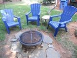 Fire pit with blue plastic Adirondack chairs
