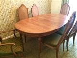 Oval dining-room table with leaf and six cane-back chairs