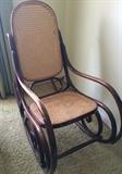 70s curved-arm rocker with cane backing