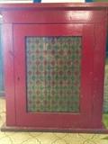 Antique table-top cabinet with shelves and stained-glass door front