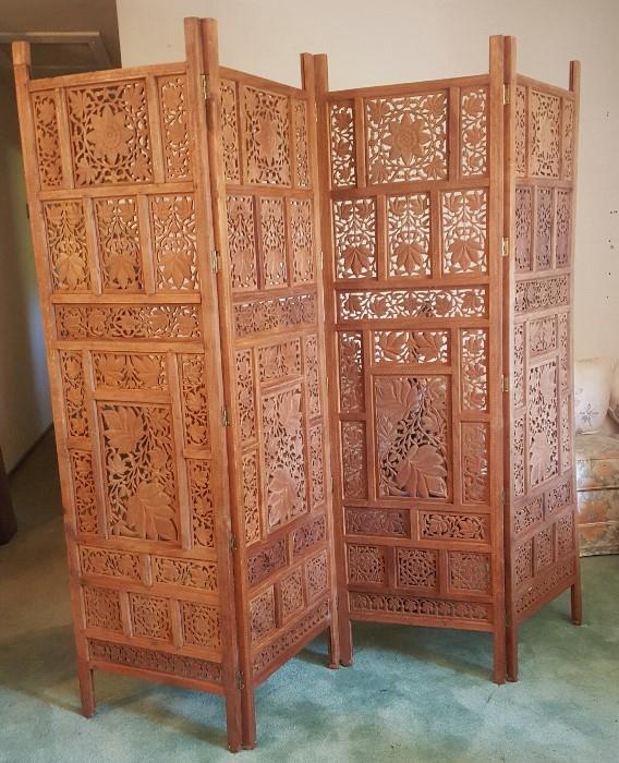 Hand-carved teak screen. Large heavy piece with very ornate leaf and flower carvings. Very nice 19505s-60s in great condition..