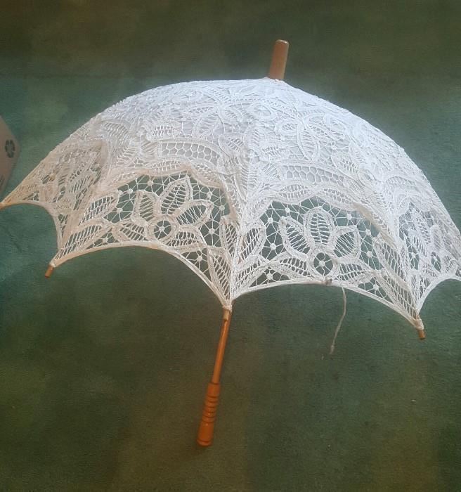 Belgian lace wooded wedding parasol. Probably 1950s. Still in the original plastic wrapping. 45" in diameter. Maple handle and frame