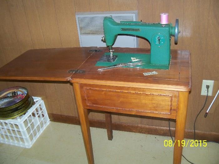 Home sewing machine in a pretty cabinet