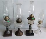 3 - C/1870's Victorian iron base Kerosene lamps, 2 w/figural stems ~ C/1890's pressed glass Victorian Peanut Pattern oil lamp