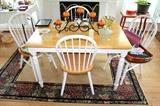 Kitchen table with 4 chairs, rug, and glassware