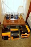 End table, stereo, brass lamp, and boxes of slides