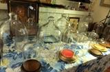 a collection of glass cloches and small cases.