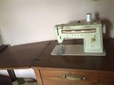 Singer sewing machine in original cabinet
