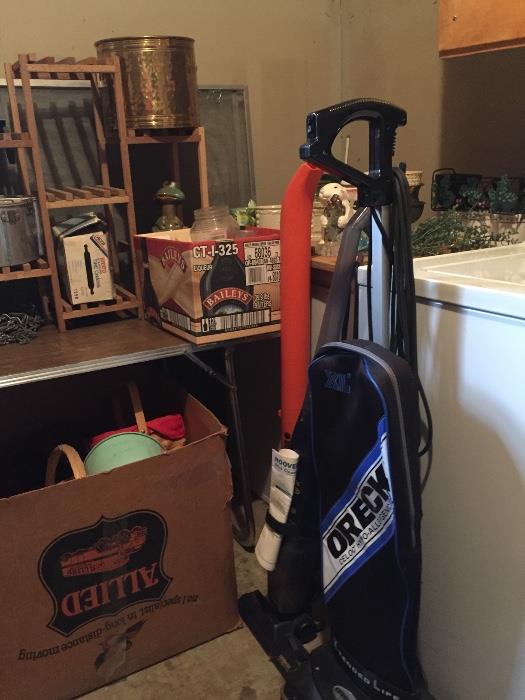 Vacuums, sweepstick, tins, baskets, planters and lawn and garden ceramics