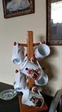Norman Rockwell mugs and stand