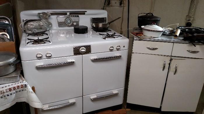 vintage gas stove and metal cabinets