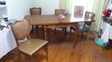 This is a square table that opens up to a rectangle with 4 chairs